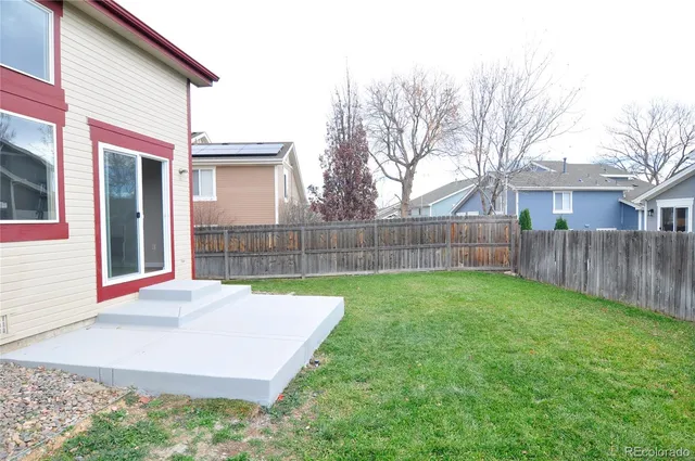 a view of a backyard of the house