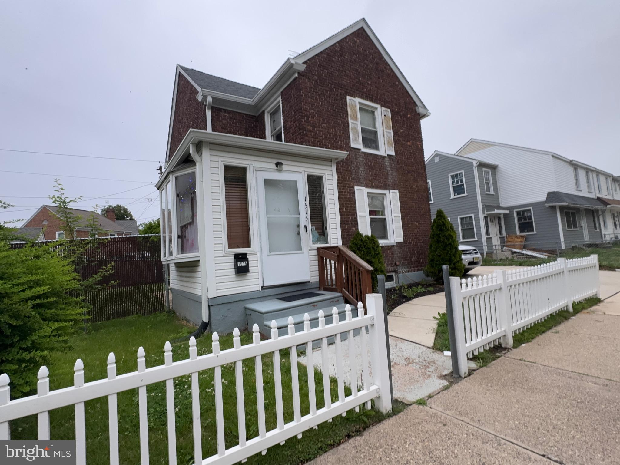 1515 Collings Road Camden, NJ 08104 - Photo 1 of 23 a front view of a house with yard