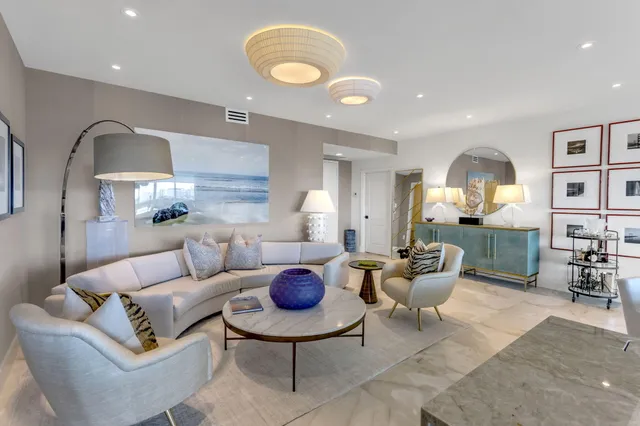 a large kitchen with stainless steel appliances granite countertop a lot of counter space and a sink