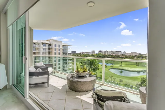 a view of a balcony with chair and a potted plant