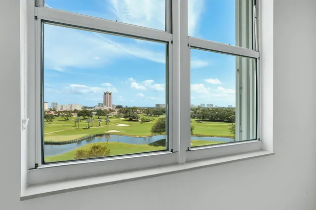 a spacious bedroom with a bed a couch and dresser