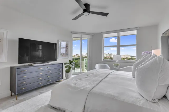 a bathroom with a double vanity sink mirror and toilet