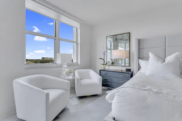 a view of a tall building with a tree in front