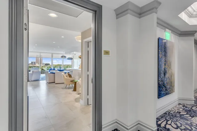 a view of kitchen and dining area with chandelier