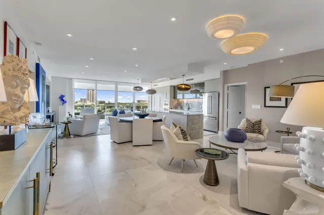 a view of a dining room with furniture and a potted plant