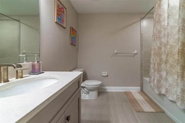 a kitchen with stainless steel appliances granite countertop a stove and a microwave
