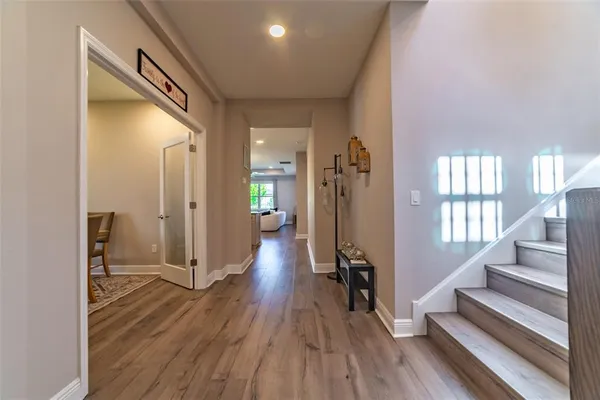 a view of a dining room with furniture and wooden floor