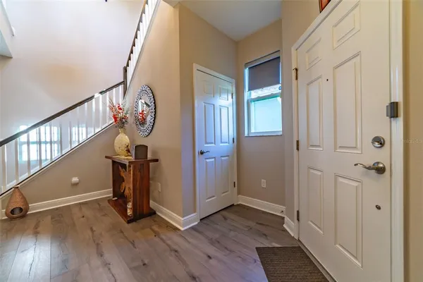 a kitchen with stainless steel appliances granite countertop a refrigerator a stove and a sink