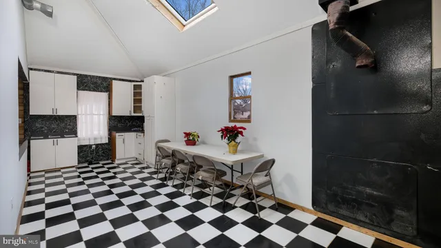 a white toilet sitting next to a bathroom sink