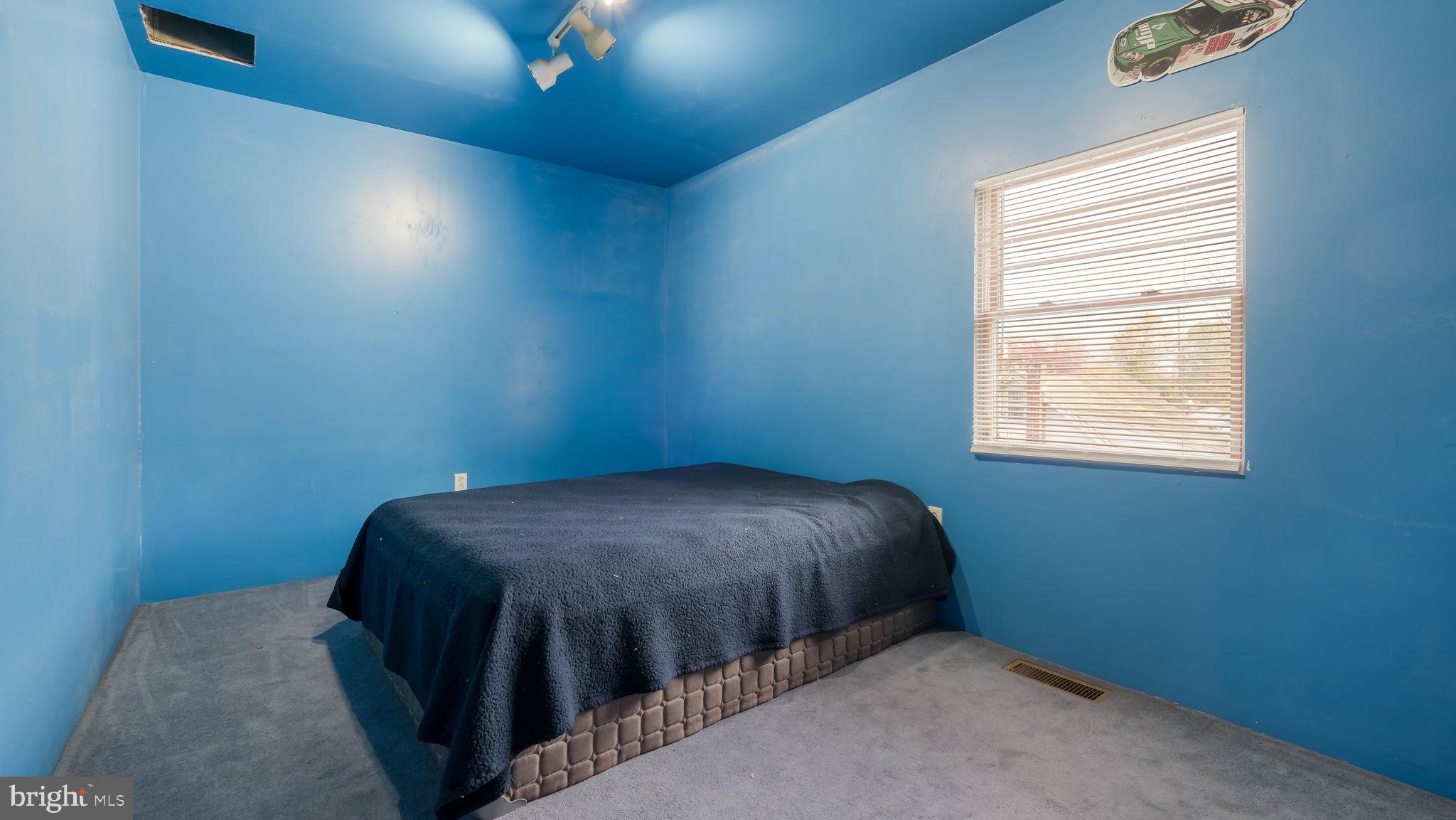 2943 East Walnut Street Colmar, PA 18915 - Photo 15 of 27 a bed sitting in a bedroom next to a window