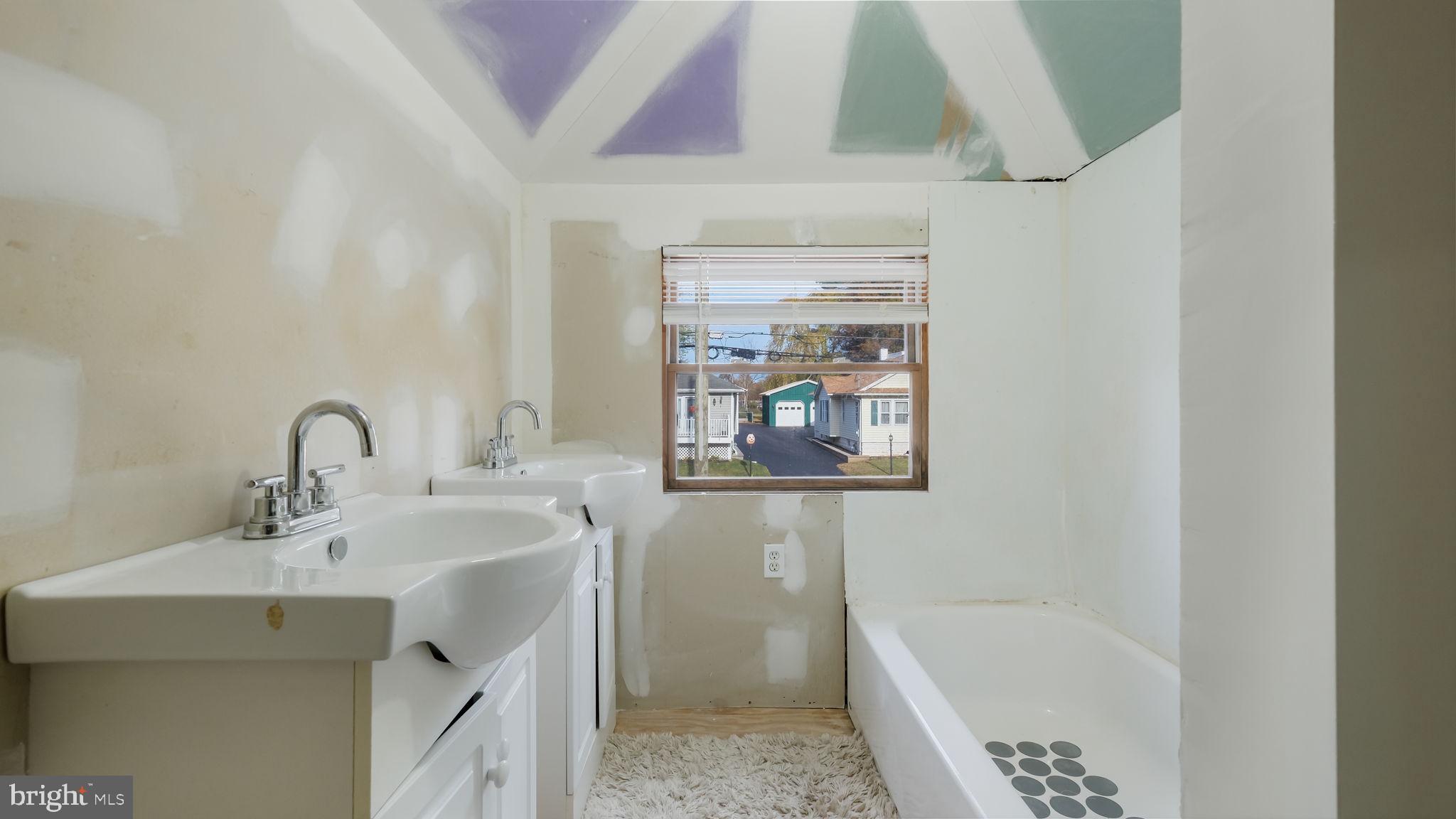 2943 East Walnut Street Colmar, PA 18915 - Photo 20 of 27 a bathroom with a sink a toilet and bathtub