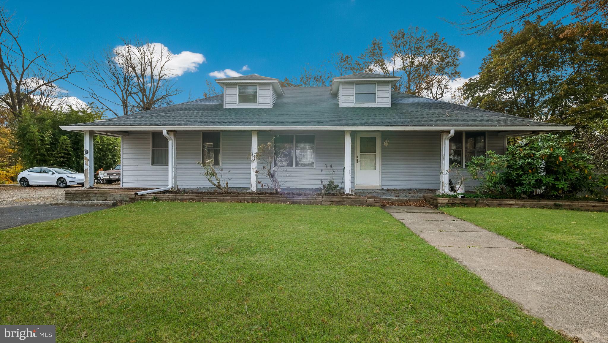 2943 East Walnut Street Colmar, PA 18915 - Photo 2 of 27 a front view of house with yard and green space