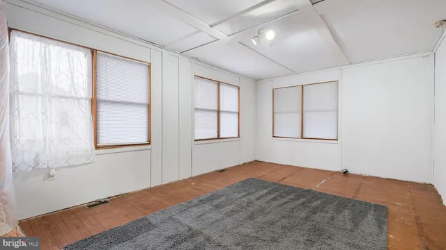 a bathroom with a shower curtain and a toilet