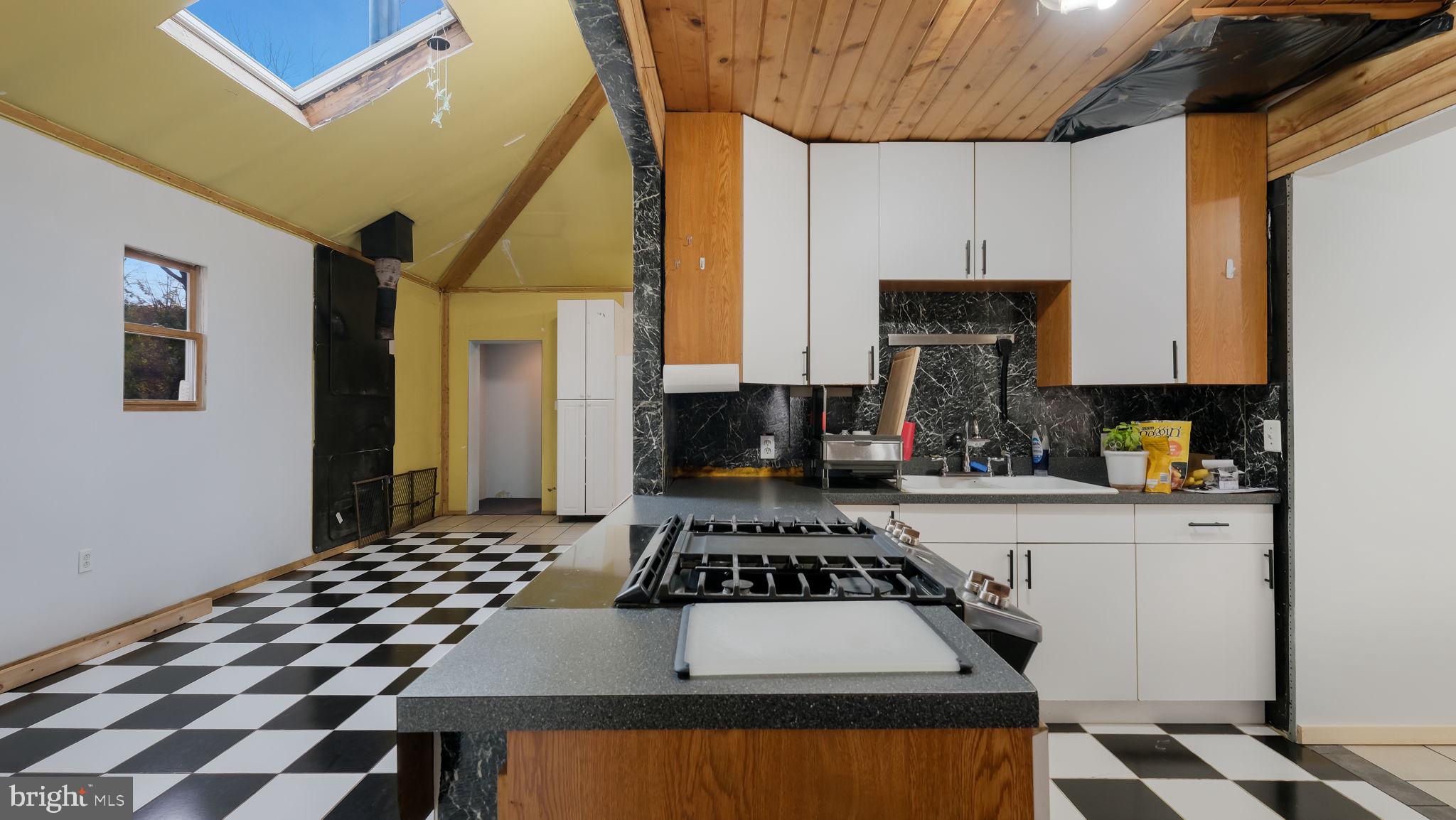 2943 East Walnut Street Colmar, PA 18915 - Photo 8 of 27 a kitchen with a stove a sink and a refrigerator