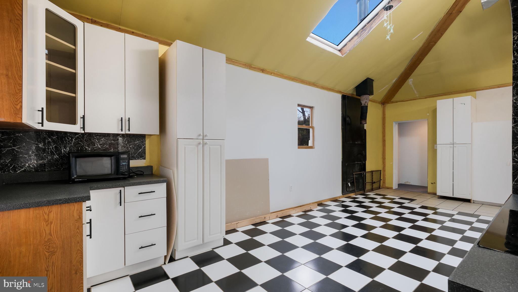 2943 East Walnut Street Colmar, PA 18915 - Photo 9 of 27 a kitchen with a refrigerator and cabinets