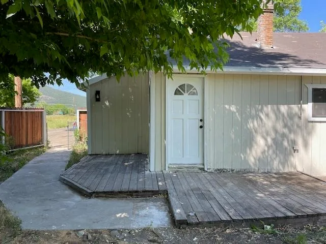 a view of a house with a tub and tree