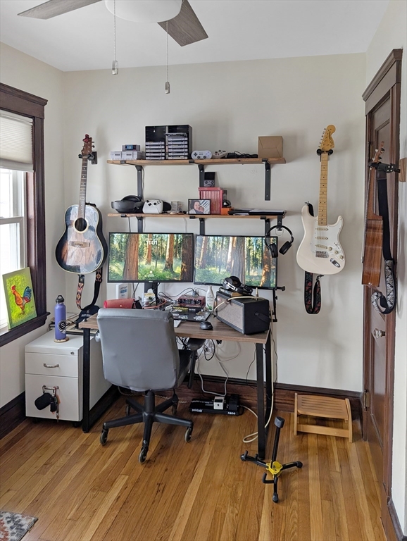 159 Forest Hills Street, Unit 2 Boston, MA 02130 - Photo 11 of 24 a room with gym equipment and wooden floor