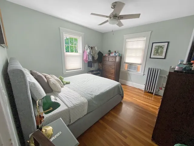 a bedroom with a bed furniture and a window