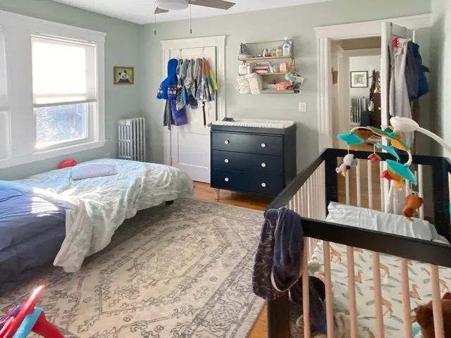 a bedroom with furniture and a window