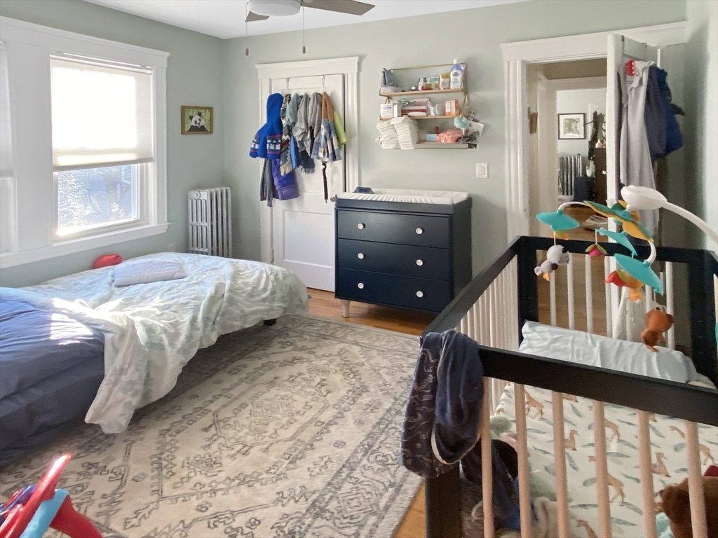 159 Forest Hills Street, Unit 2 Boston, MA 02130 - Photo 15 of 24 a bedroom with furniture and a window