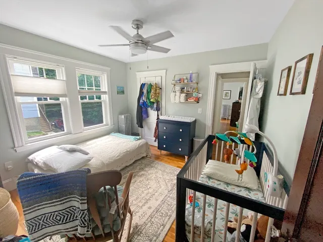 a bedroom with furniture and a window