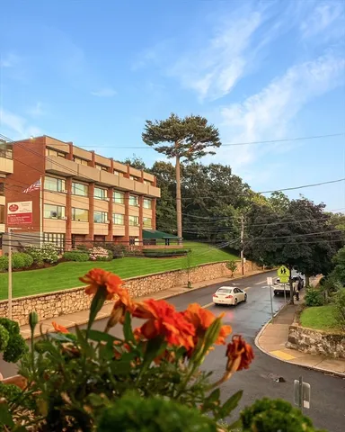 a view of a house with swimming pool and yard