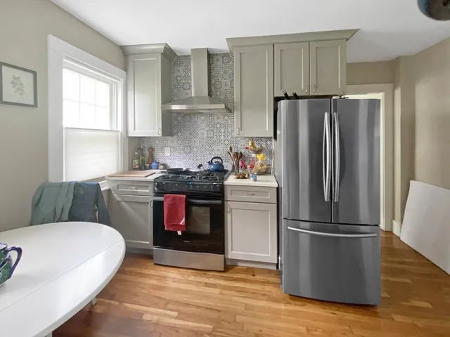 a kitchen with a refrigerator sink and stove