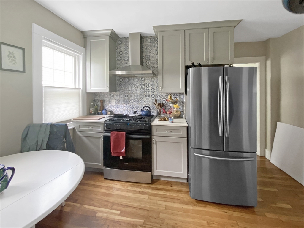 159 Forest Hills Street, Unit 2 Boston, MA 02130 - Photo 5 of 24 a kitchen with a refrigerator sink and stove