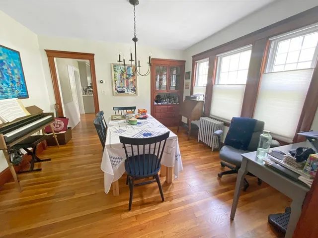 a view of a livingroom with furniture window and wooden floor