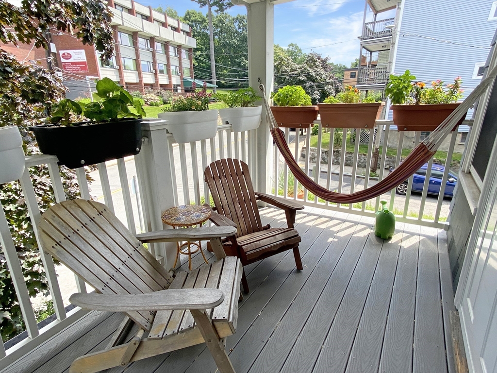 159 Forest Hills Street, Unit 2 Boston, MA 02130 - Photo 9 of 24 a view of a chairs and tables in the balcony