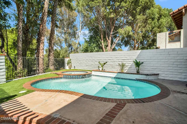 a view of a swimming pool with a patio