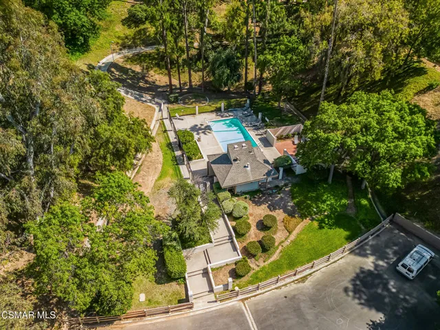 an aerial view of residential house with outdoor space