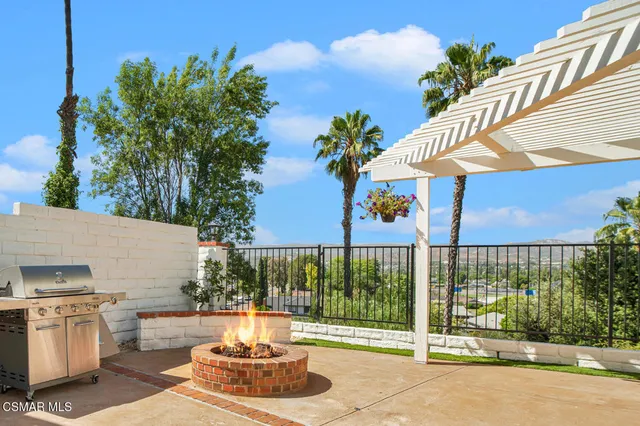 a view of a patio with couches and potted plants