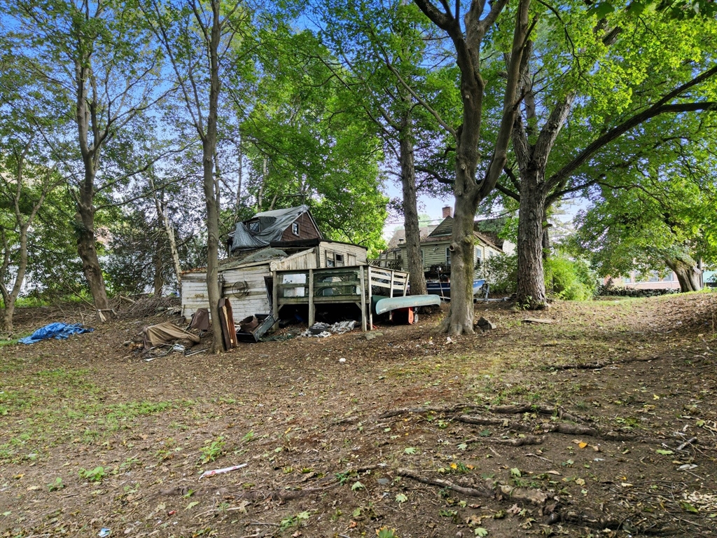 29 Conant Street Beverly, MA 01915 - Photo 14 of 20 a view of a wooden house with a large tree and sitting area