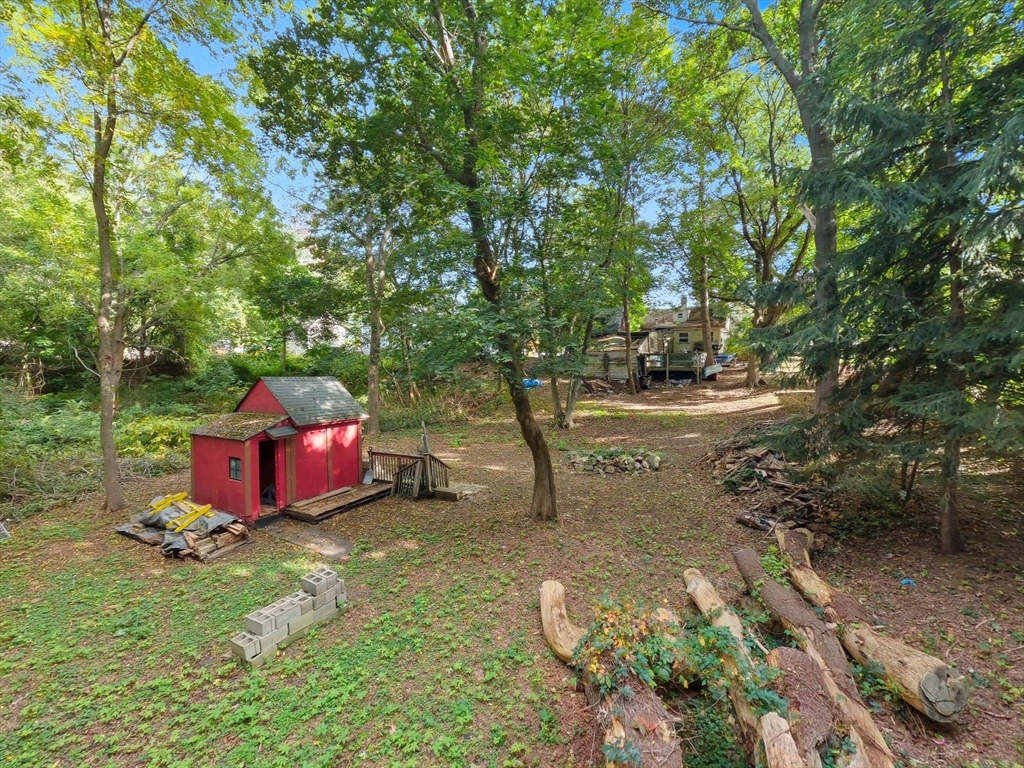 29 Conant Street Beverly, MA 01915 - Photo 19 of 20 a view of a wooden house with a yard