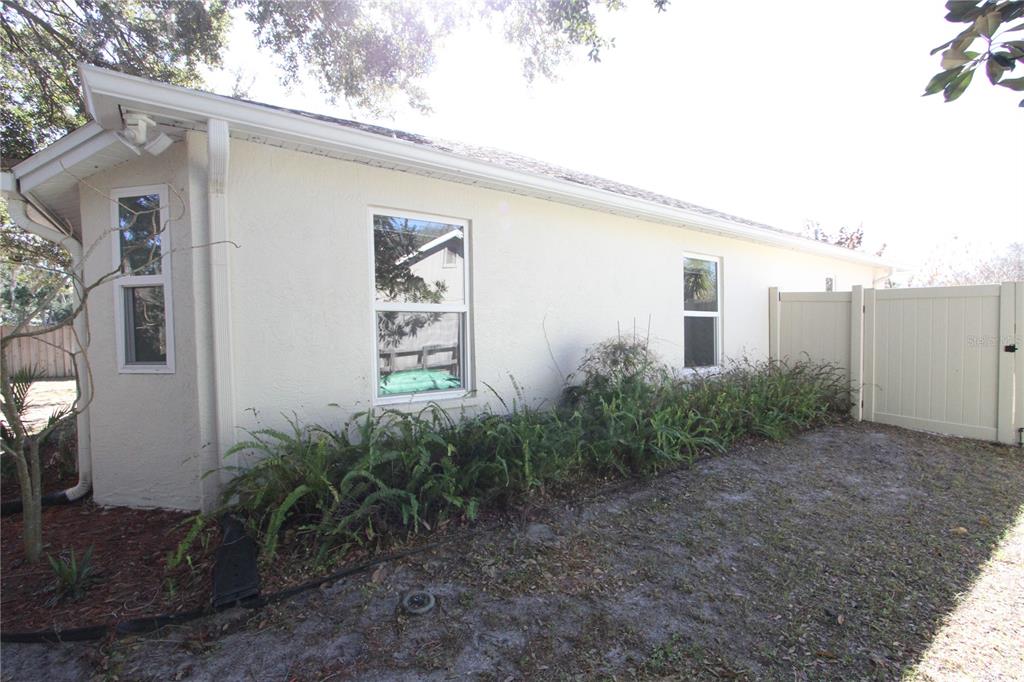 1414 Norwick Drive Lutz, FL 33559 - Photo 38 of 43 a front view of a house with garden