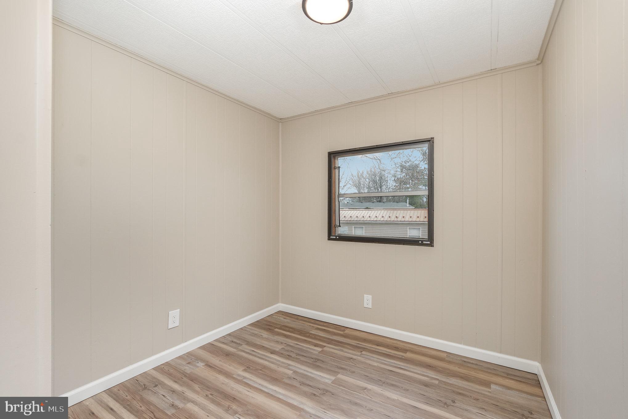 56 Pine Road Newville, PA 17241 - Photo 17 of 27 a view of empty room with wooden floor