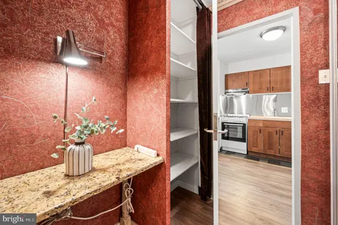 a bathroom with a sink a vanity a mirror and a bathtub