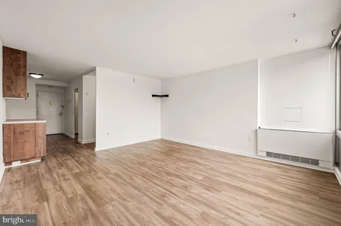 a view of hallway with wooden floor