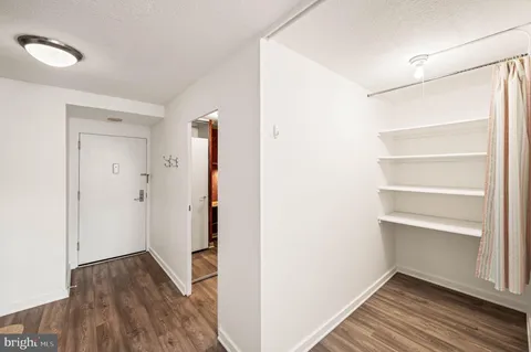 an entryway and a livingroom with furniture