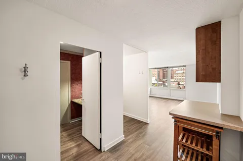 a kitchen with a table and chairs