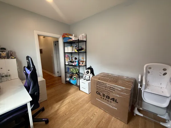 a bed room with a bed and a television