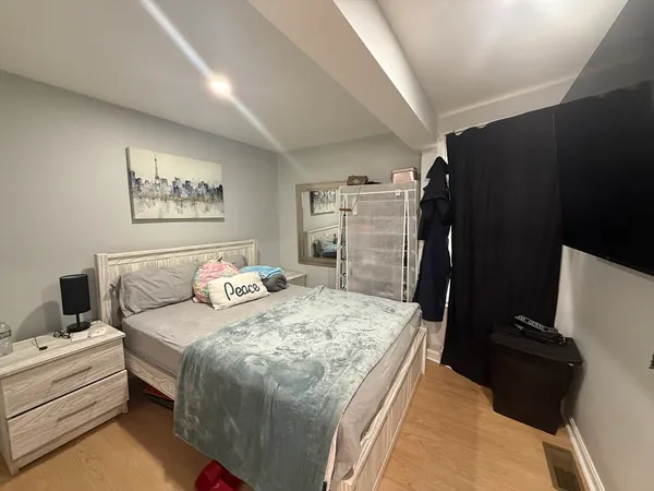 a bed room with furniture and a window