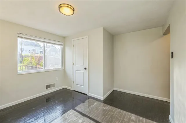 a view of an empty room and window