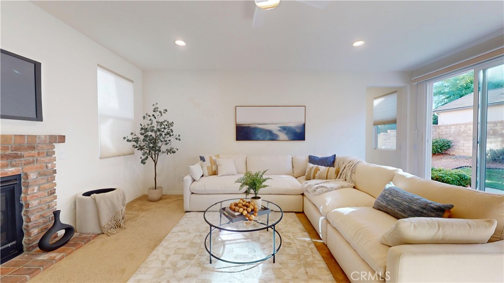 28620 Vista Del Rio Drive Valencia, CA 91354 - Photo 16 of 40 a living room with furniture and a fireplace