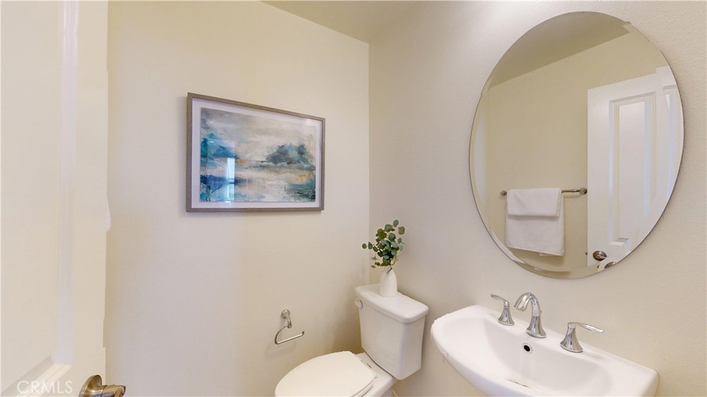 28620 Vista Del Rio Drive Valencia, CA 91354 - Photo 21 of 40 a bathroom with a toilet and a sink