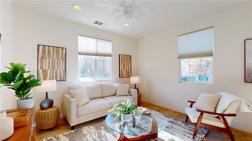 28620 Vista Del Rio Drive Valencia, CA 91354 - Photo 23 of 40 a living room with furniture and a potted plant