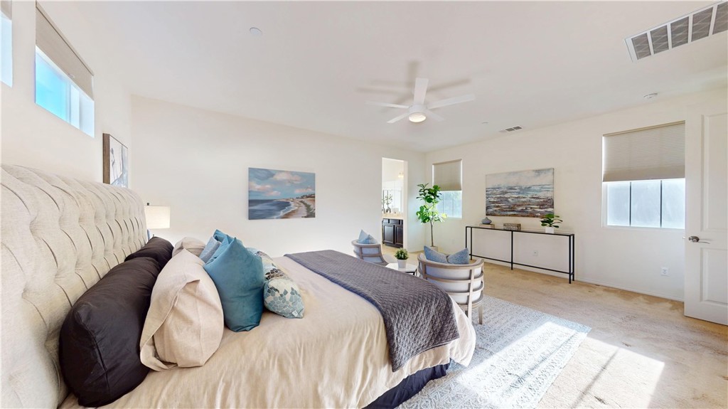 28620 Vista Del Rio Drive Valencia, CA 91354 - Photo 26 of 40 a bedroom with a bed cabinets and window