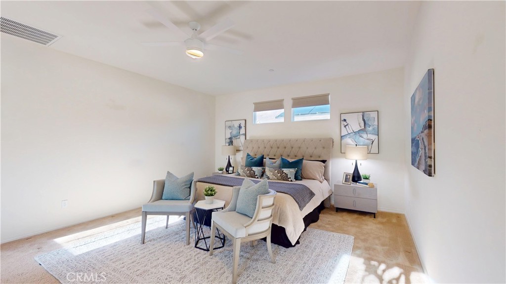 28620 Vista Del Rio Drive Valencia, CA 91354 - Photo 28 of 40 a bedroom with a bed and a chair