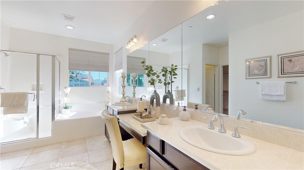 28620 Vista Del Rio Drive Valencia, CA 91354 - Photo 30 of 40 a bathroom with a double vanity sink and a mirror